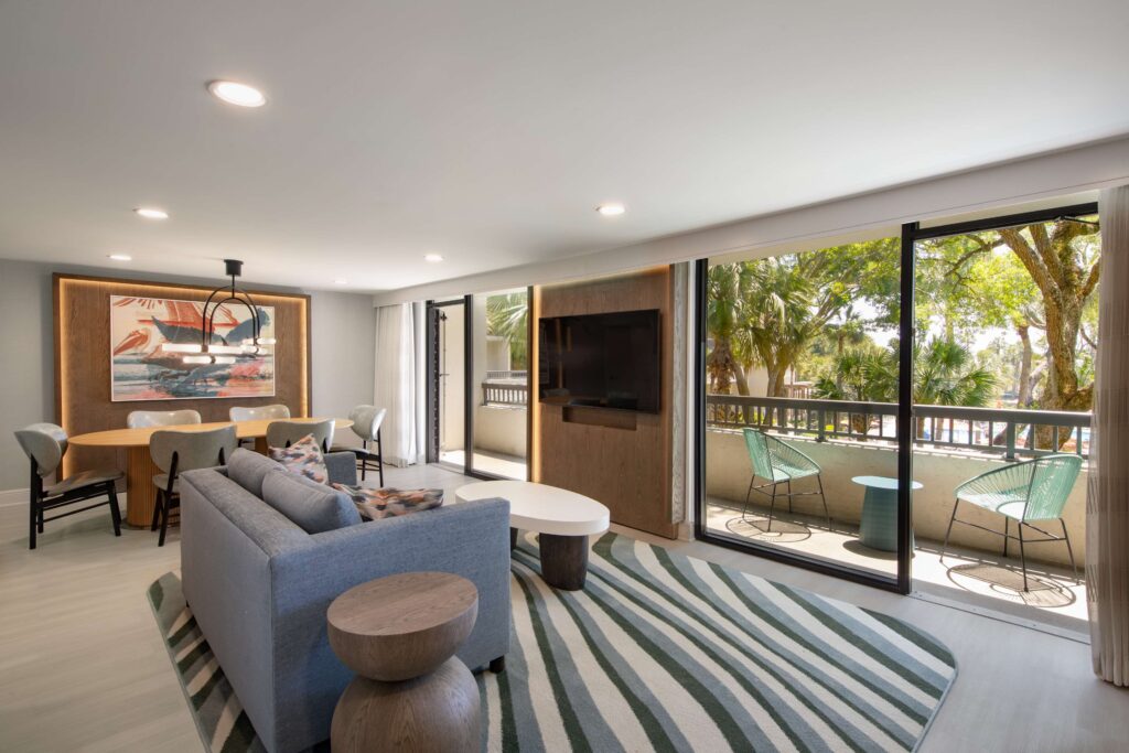 Living area with balcony and stylish decor.