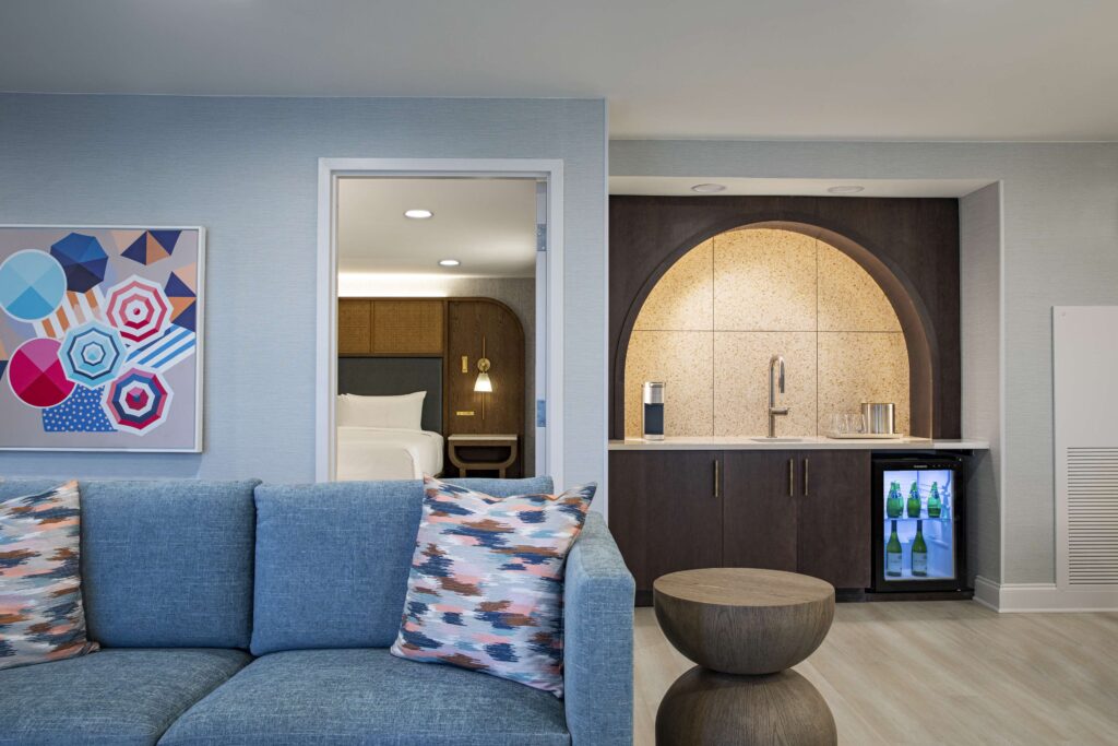 Suite kitchenette with arched backsplash design.