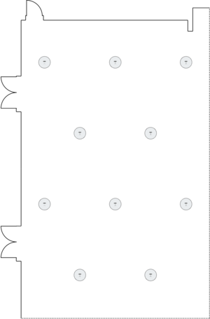 Long rectangular table setup in a small meeting room.