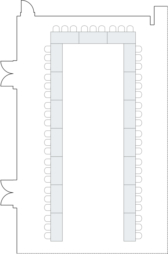 U-shaped table arrangement in a conference room.