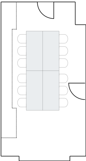 Compact conference room with rectangular table.