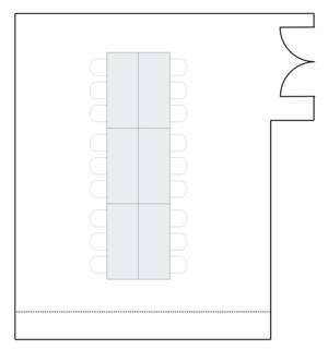 Meeting room layout with long conference table setup.