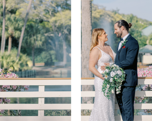 Bride and groom smiling on outdoor balcony.