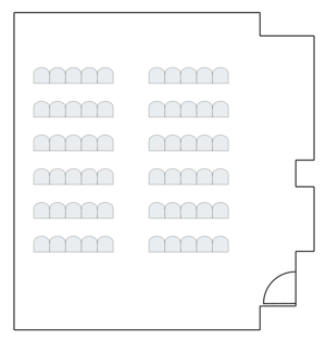 Long room layout with evenly spaced round tables.