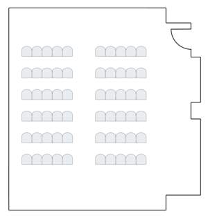 Meeting room setup with theater-style seating arrangement.