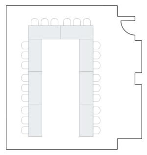 Meeting room layout with U-shaped table configuration.