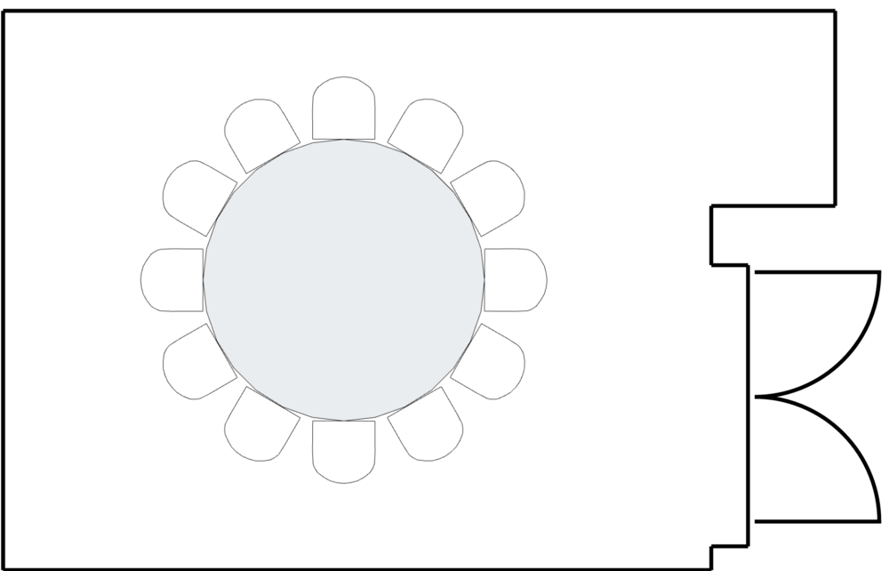 Small meeting room with a round table layout.