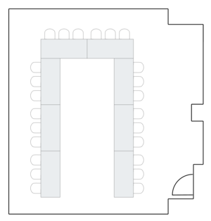 Small room layout with U-shaped table arrangement.