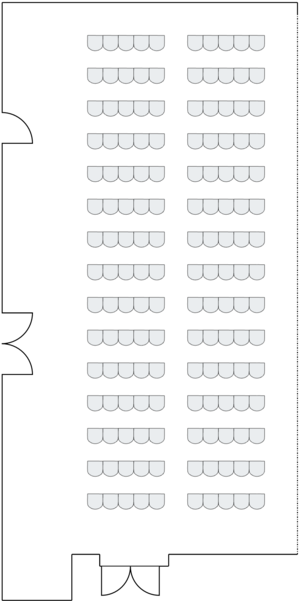 Long room with theater-style seating arrangement.