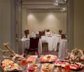 Banquet room featuring appetizers and decorated tables.