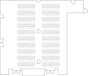 Large hall with rows of classroom-style tables.